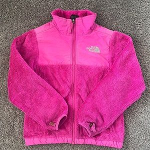 Fuchsia pink girls North Face zip up fleece. Very warm and cozy.